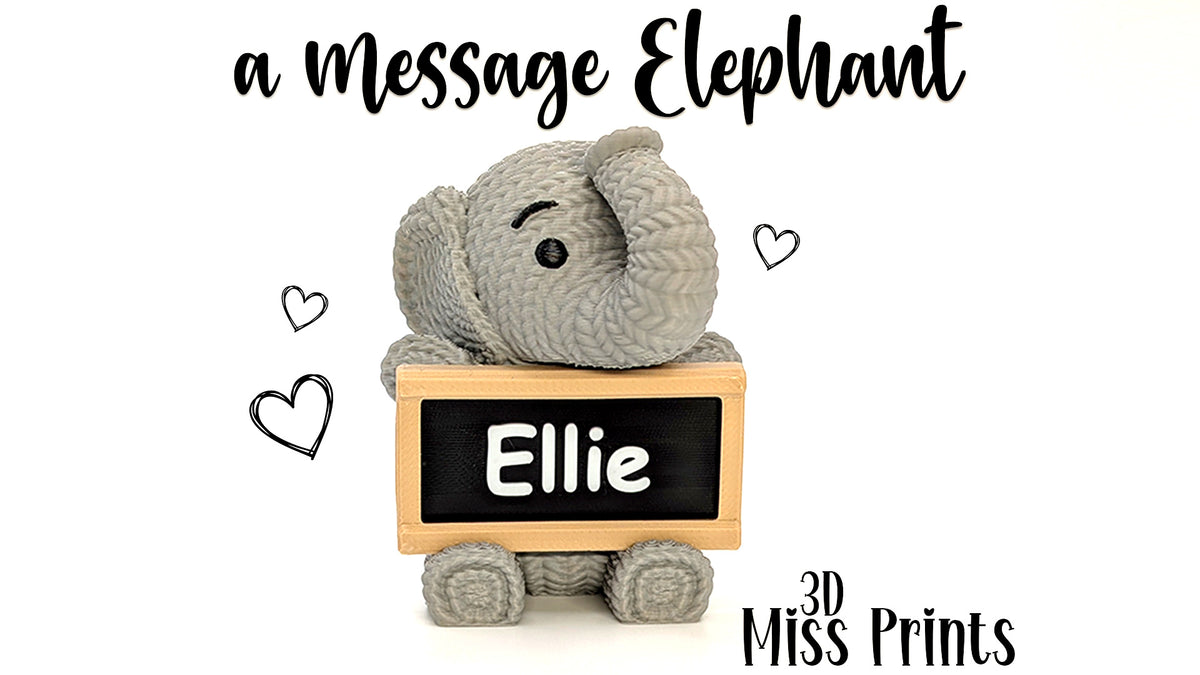 Faux Elephant holding sign!